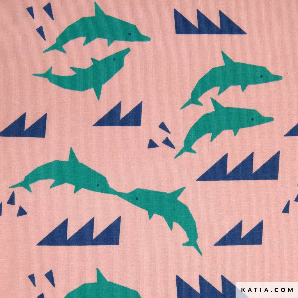 Tela de punto jersey rosada de Katia Fabrics con un hermoso estampado de delfines y olas geométricas, ideal para coser poleras y ropita de verano.